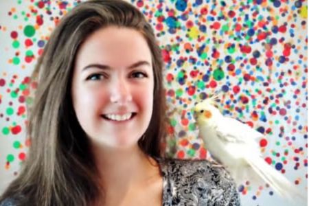 Zoe Demery (animal behaviourist) with her parrot